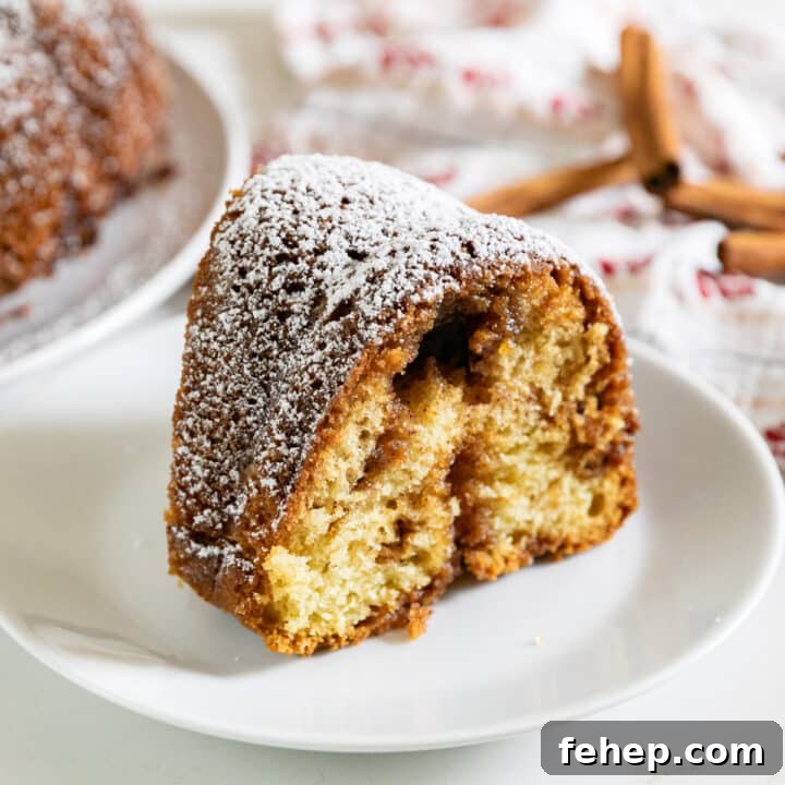 A slice of coffee cake on a white plate.