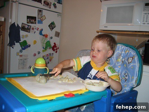 When Should Children Learn to Cook? Age Guide for Parents 2 toddler cutting potatoes