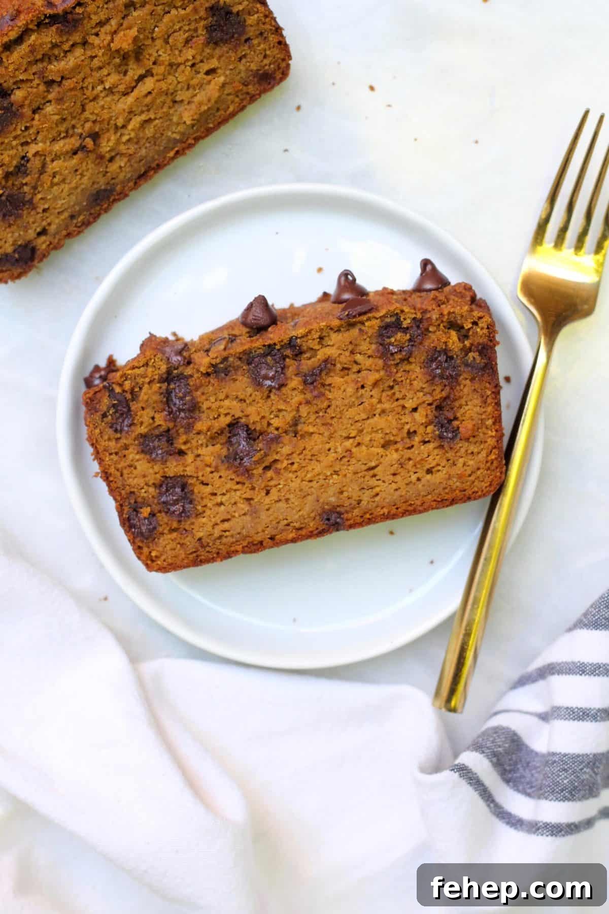 Almond Flour Pumpkin Bread Made with a Whole Can of Pumpkin 5 slice of pumpkin bread on white plate