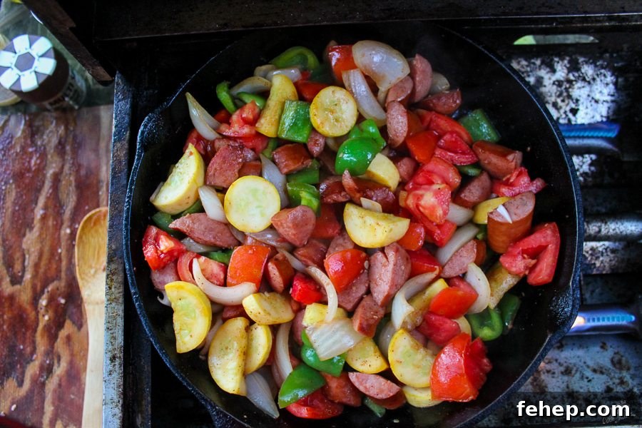 Gluten-Free Camping Meal Ideas for Delicious Outdoor Cooking 6 a top down view of a pan of vegetables and sliced sausages