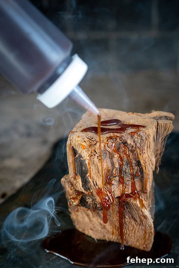Griddle Bacon and Eggs: Perfectly Cooked Breakfast in Minutes 13 Drizzling hot honey on wood with smoke in background.