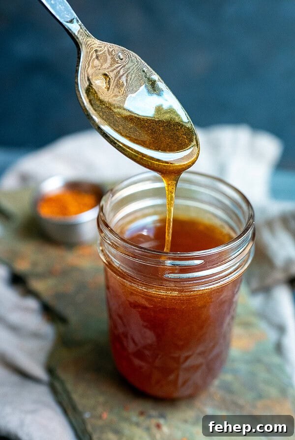 Griddle Bacon and Eggs: Perfectly Cooked Breakfast in Minutes 14 Spoon drizzling gochugaru hot honey.