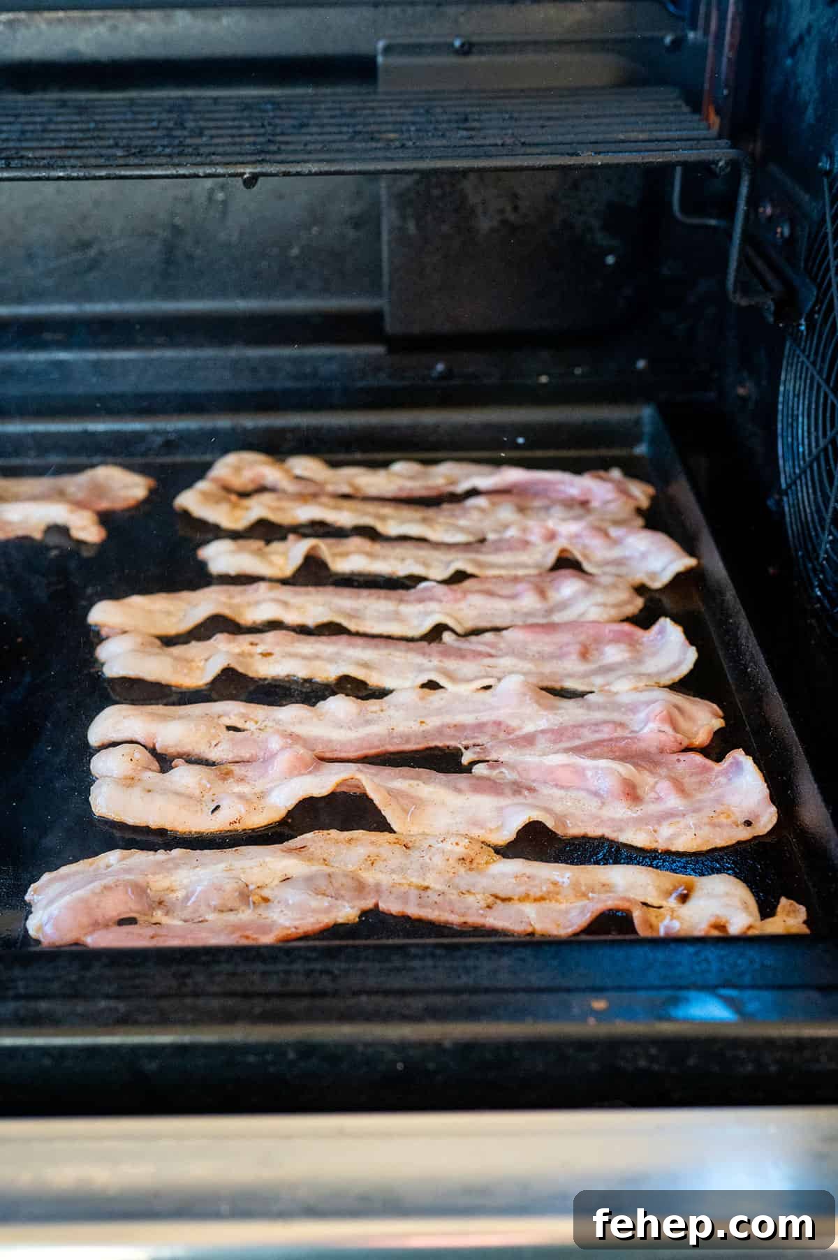 Griddle Bacon and Eggs: Perfectly Cooked Breakfast in Minutes 5 raw bacon on griddle.