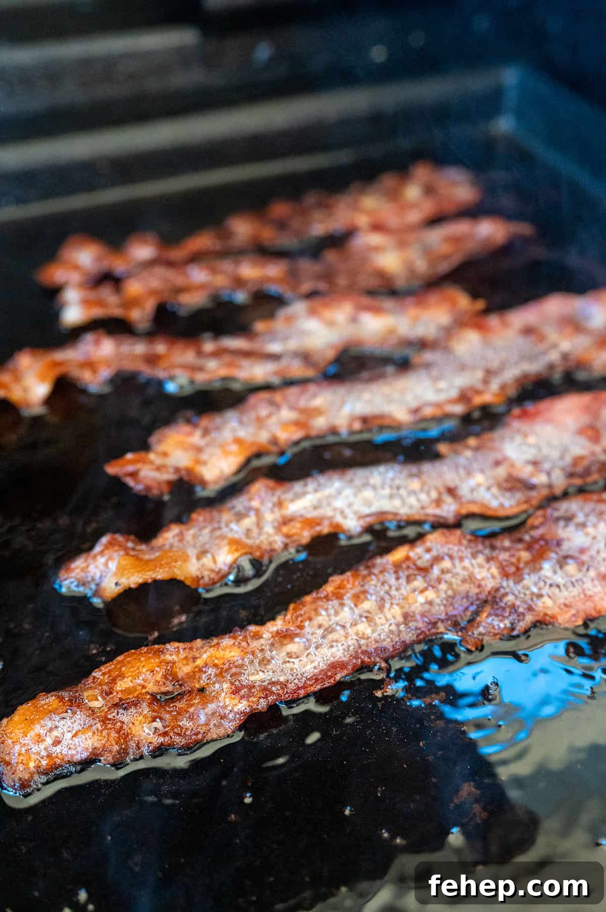 Griddle Bacon and Eggs: Perfectly Cooked Breakfast in Minutes 7 crispy bacon on griddle.