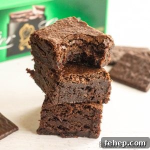 after eight brownies in a stack in front of box