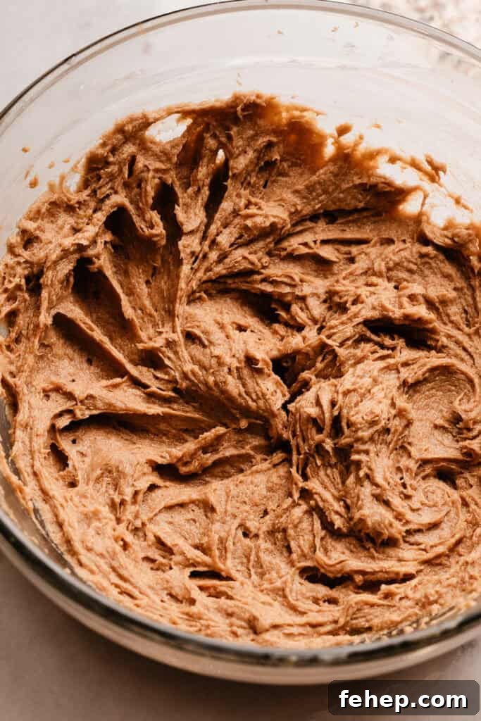 A bowl of the butter, sugar, eggs, and vanilla creamed together.