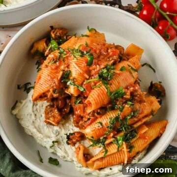 Unstuffed Shells Recipe: Cheesy Baked Pasta Skillet 9 unstuffed pasta shells in red meat sauce on creamy cheesy mixture.