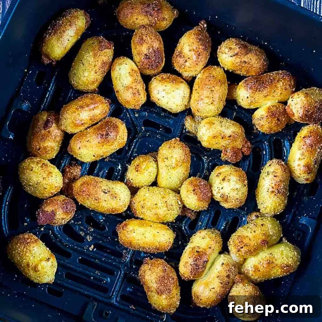 Crispy Air-Fried Gnocchi with Garlic Parmesan Crunch 7 Crispy air fried gnocchi in the air fryer basket at the end of the cook time.