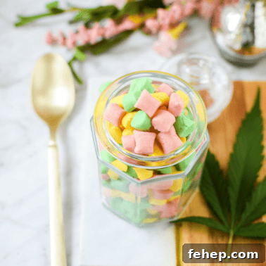 How to Make Cannabis-Infused Candy Ropes at Home 13 A white counter top with a gold spoon and a glass jar filled with cannabis butter mints.