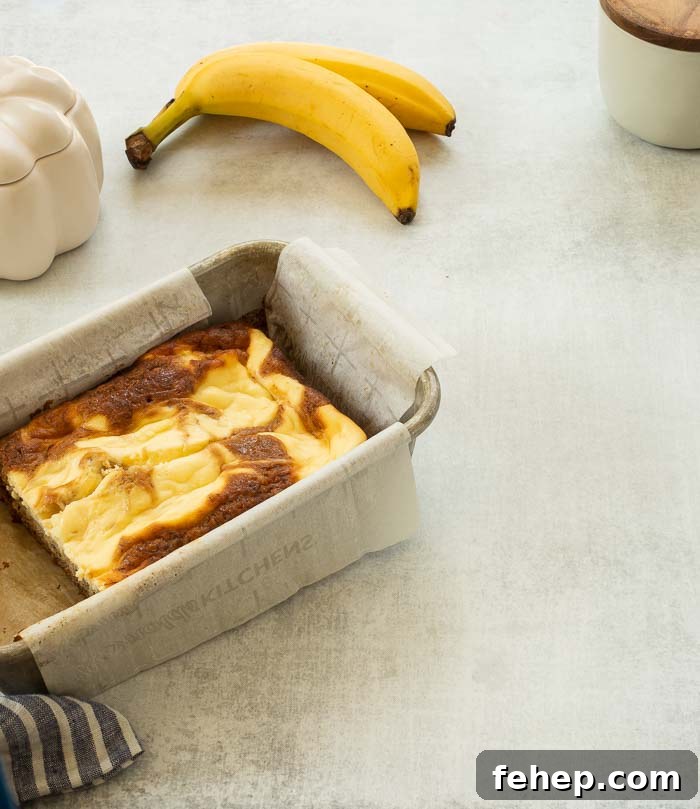 A photo of cream cheese banana bread with swirls 