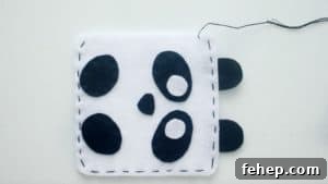 Panda Plush Sewing Pattern for Kids with Video Tutorial 11 panda softie stitched with black thread ready to be stuffed