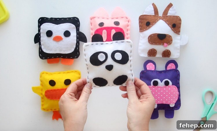 Panda Plush Sewing Pattern for Kids with Video Tutorial 5 panda softie being held by hands