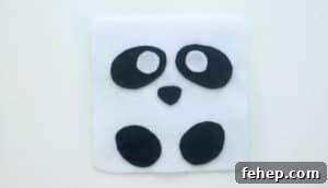 Panda Plush Sewing Pattern for Kids with Video Tutorial 8 white square of felt with black ovals of felt for eyes and feet