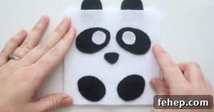 Panda Plush Sewing Pattern for Kids with Video Tutorial 9 gluing on white felt circles for panda eyes