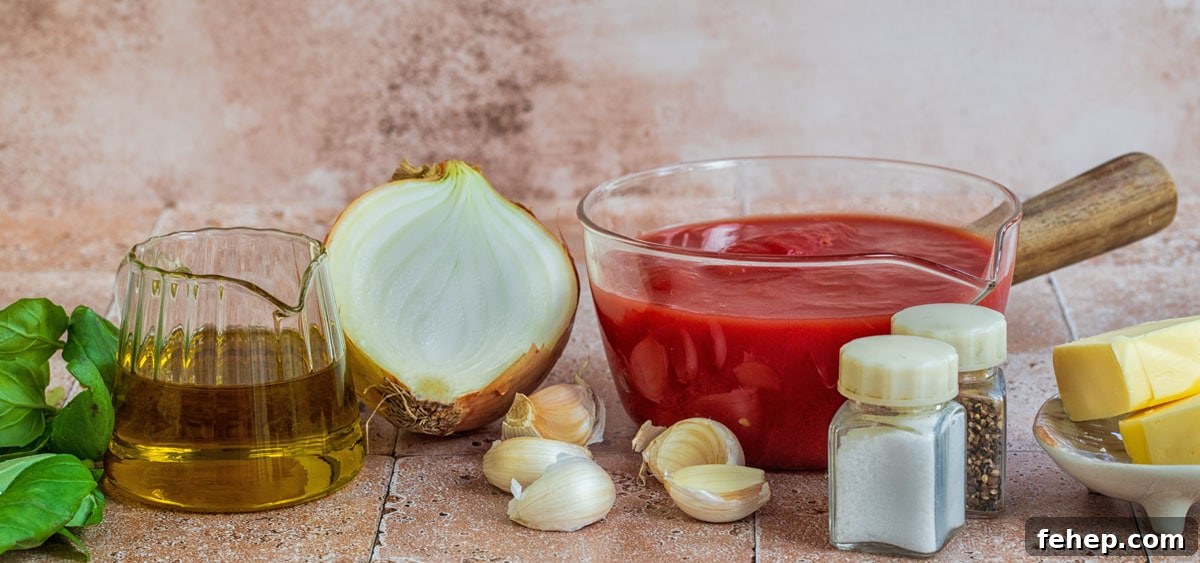 Authentic San Marzano Tomato Sauce Recipe for Rich Flavor 4 A glass jug of olive oil, half a white onion, a glass bowl of crushed tomatoes, garlic cloves, basil leaves, salt and pepper shakers, and pieces of butter are arranged on a tiled surface.
