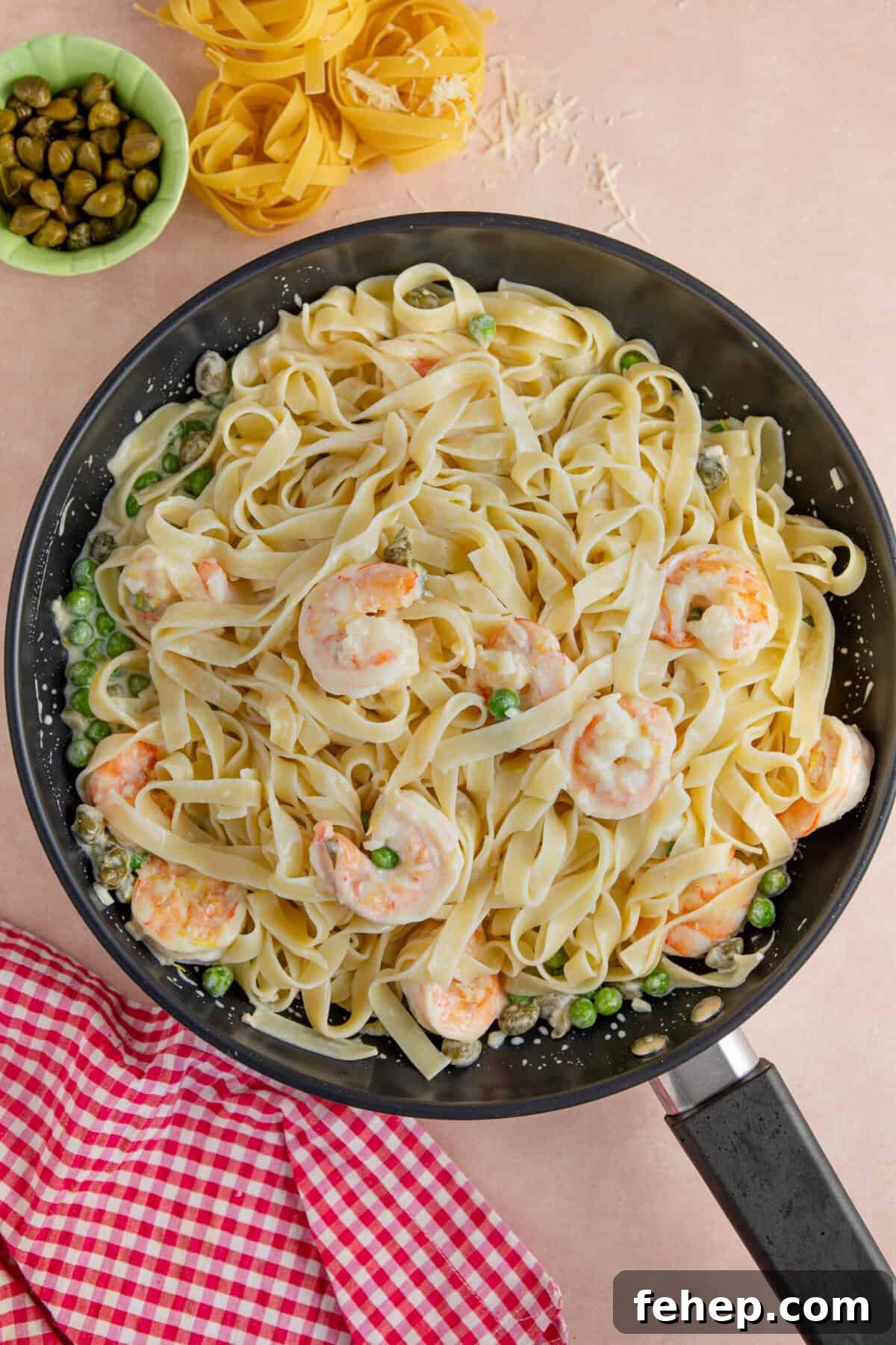 Creamy Garlic Prawn Pasta with Parmesan and Lemon 8 Stir the gluten free pasta into the prawns and sauce.