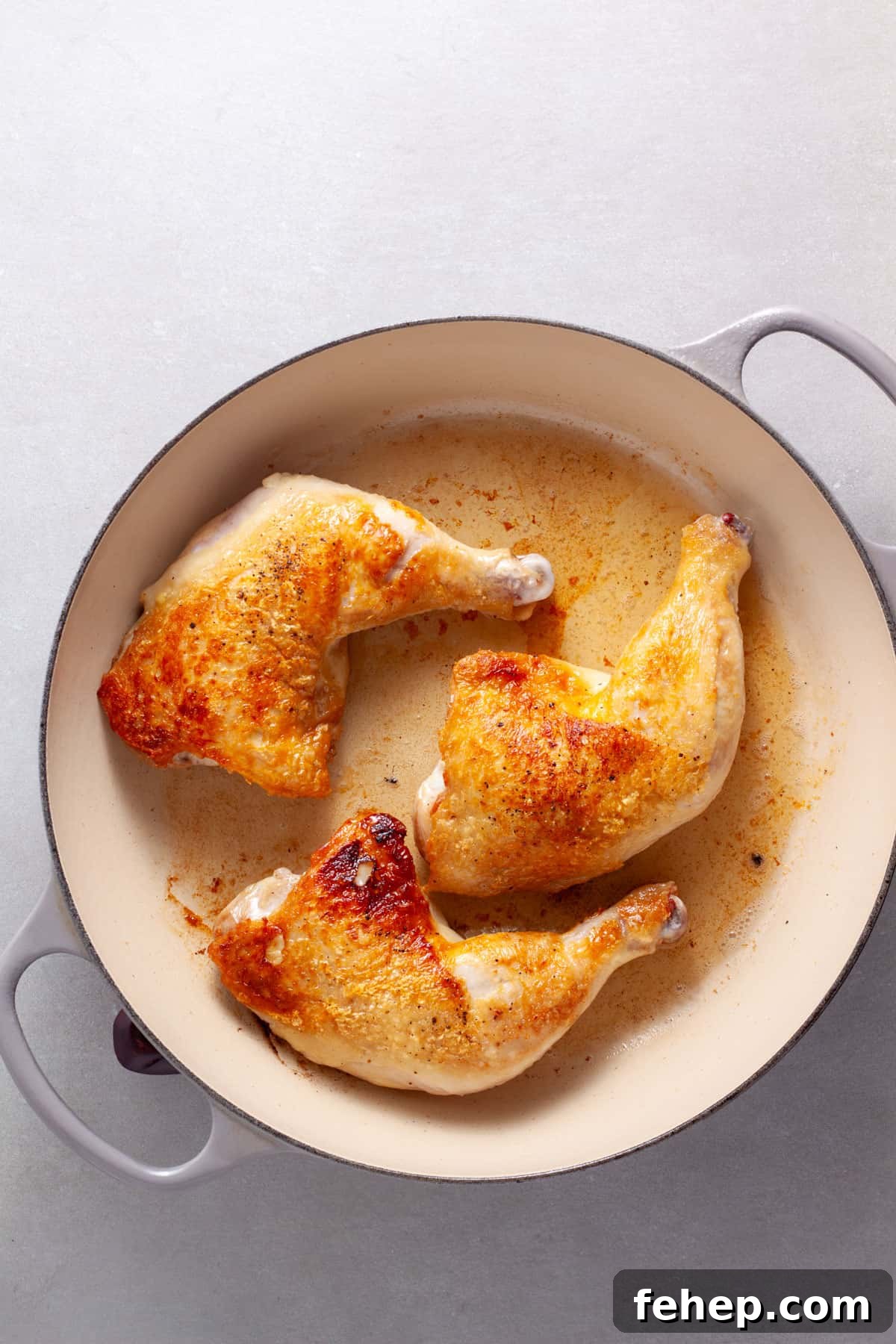 Ginger Citrus Soy Chicken with Spicy Sesame Glaze 5 Chicken leg quarters browning in a large skillet.