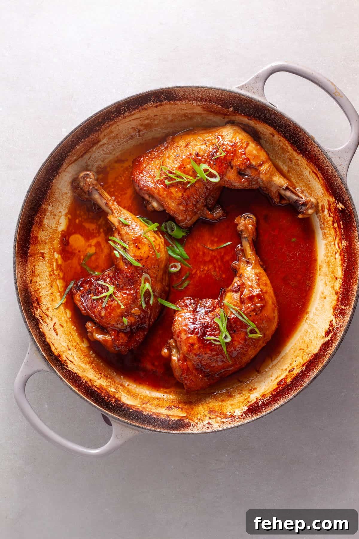 Ginger Citrus Soy Chicken with Spicy Sesame Glaze 9 Chicken leg quarters smothered in a spicy ginger, citrus and soy sauce in a large skillet.