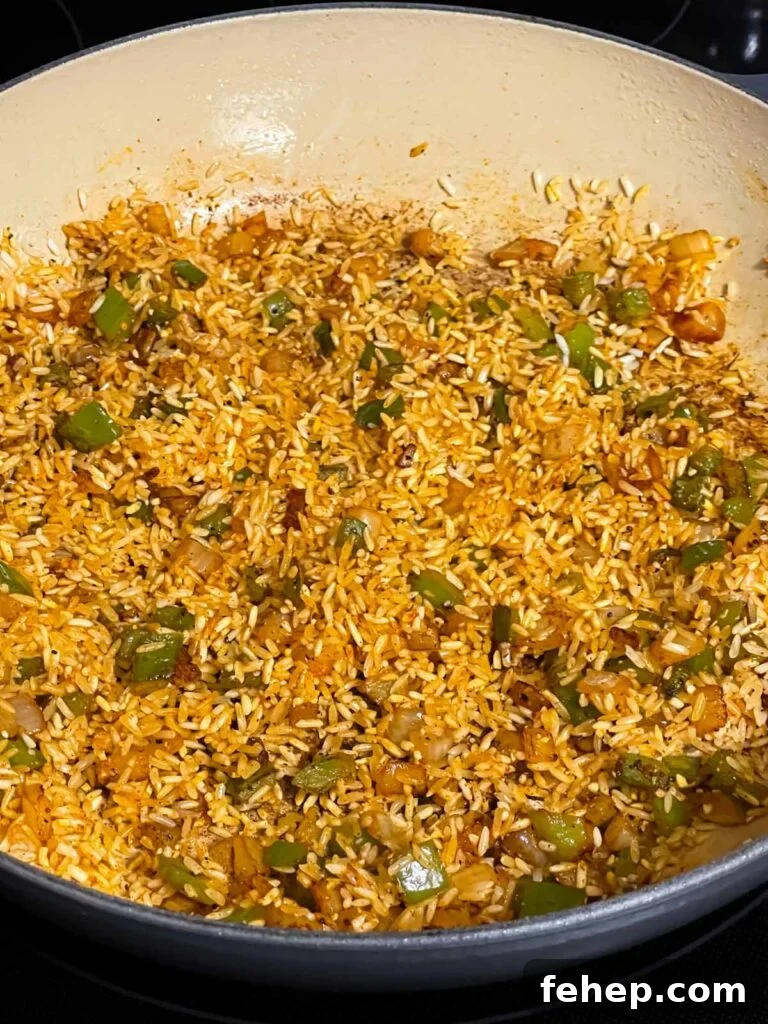 Spanish-Style Pork Chops with Garlic Tomato Rice 5 White rice, onions, green peppers, and seasonings tossed in a skillet for Spanish pork chops and rice recipe.
