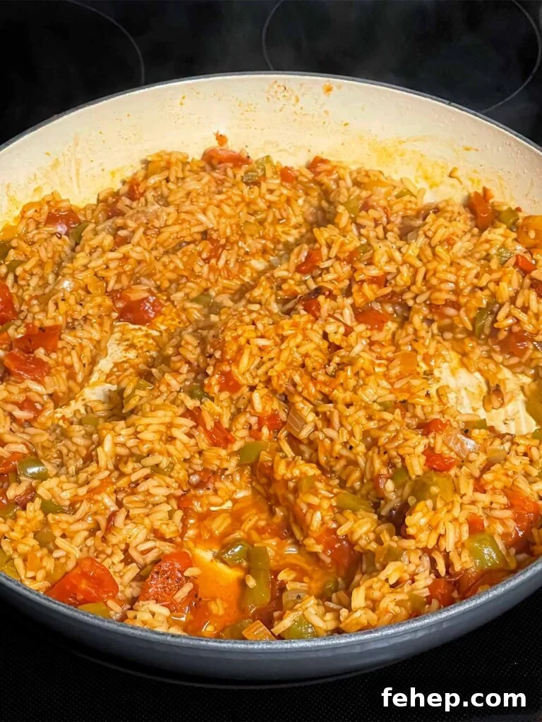 Spanish-Style Pork Chops with Garlic Tomato Rice 7 Cooked Spanish rice in a skillet.