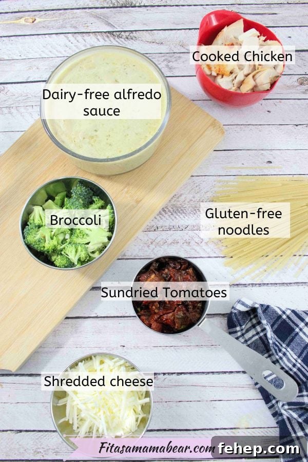 Gluten-Free Dairy-Free Chicken Alfredo Casserole Recipe 3 Ingredients like sundried tomatoes, alfredo sauce, and chicken in measuring cups