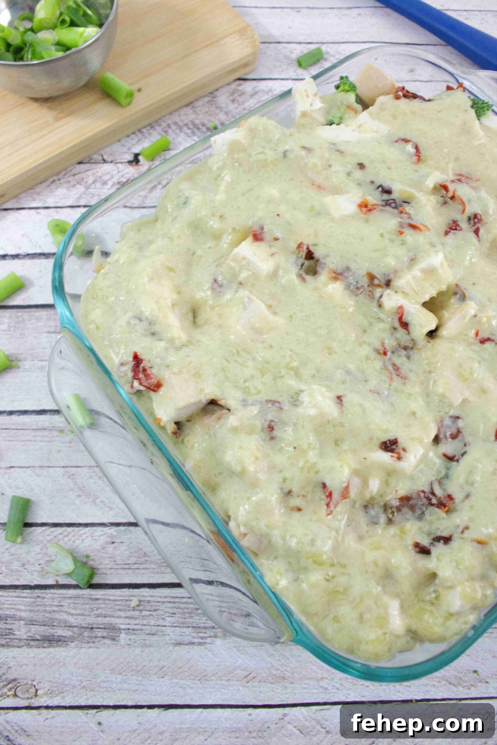 Gluten-Free Dairy-Free Chicken Alfredo Casserole Recipe 6 Glass casserole dish with alfredo sauce on top of chicken and noodles.