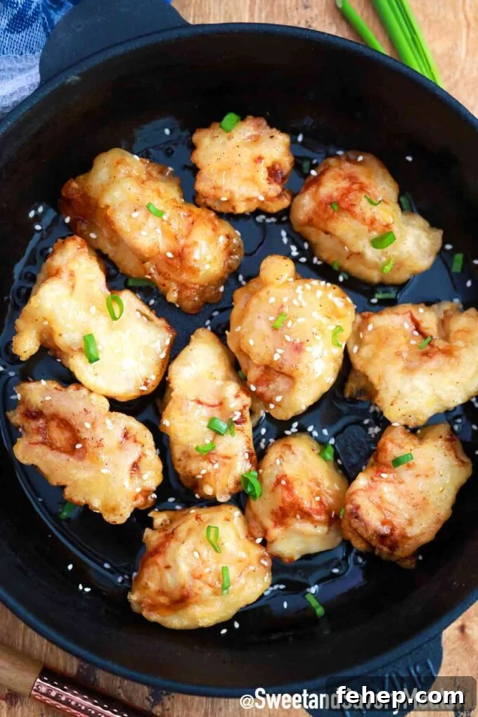 crispy honey chicken in a frying pan