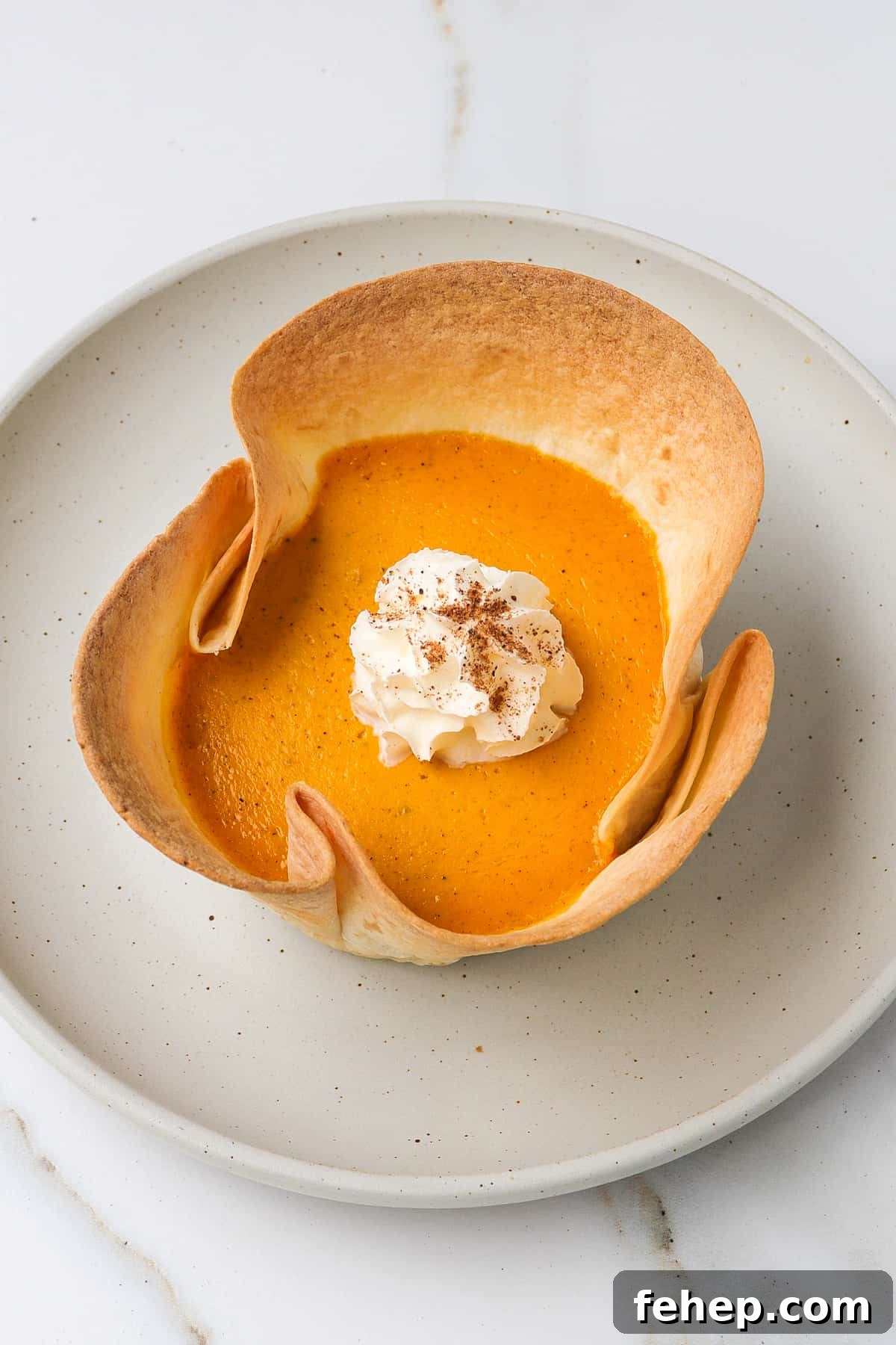 Pumpkin pie on a plate.