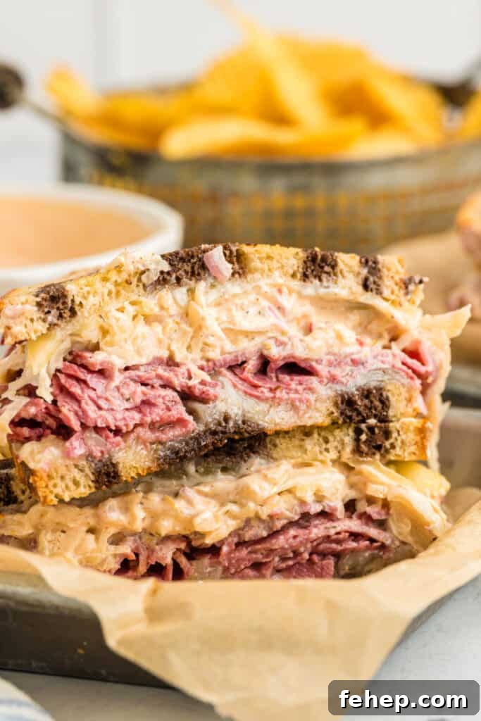 Classic Reuben Sandwich Recipe: Crispy Corned Beef & Melted Swiss 4 reuben sandwich halves stacked in deli basket