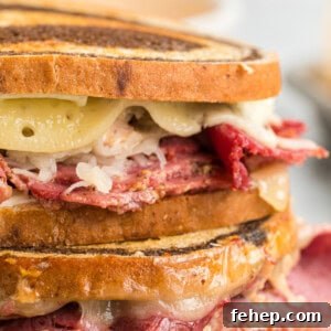 Classic Reuben Sandwich Recipe: Crispy Corned Beef & Melted Swiss 7 closeup of reuben sandwiches