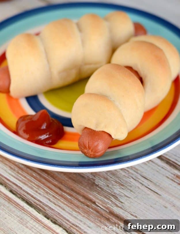 Best pigs in a blanket. No canned dough, these pigs in blankets are made from scratch! pigs in a blanket on a plate with ketchup