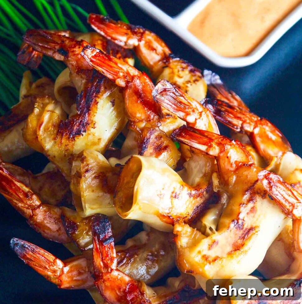 Crispy Firecracker Shrimp Recipe with Sweet-Spicy Sauce 10 Firecracker shrimp with two dipping sauces on a black platter