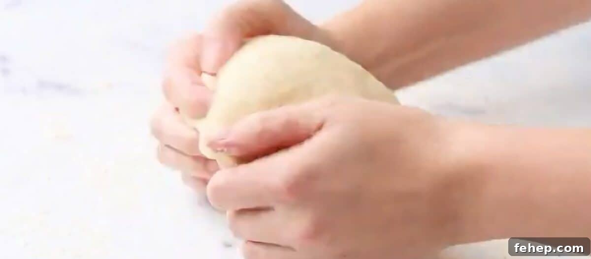 Classic Chicken and Dumplings Recipe for Comforting Weeknight Dinner 5 Kneading the dumpling dough.