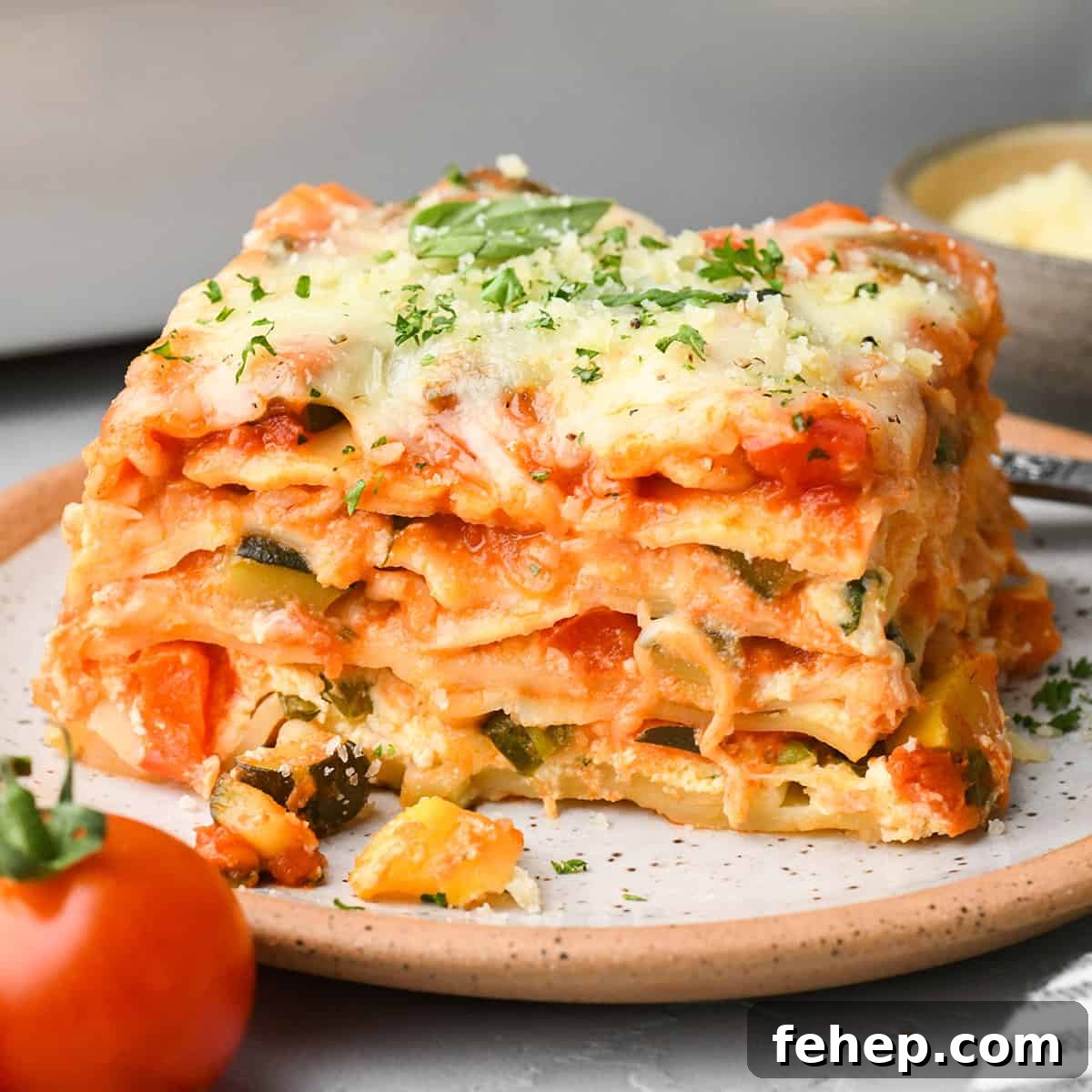 Hearty Vegetable Lasagna Recipe with Spinach & Ricotta 2 a piece of Vegetable Lasagna on a plate