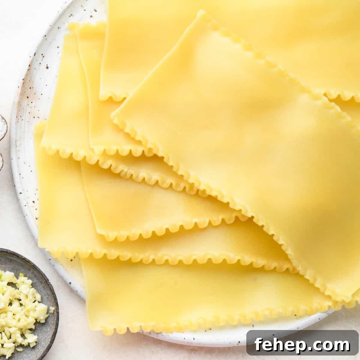 Hearty Vegetable Lasagna Recipe with Spinach & Ricotta 6 cooked lasagna noodles on a plate to make Vegetable Lasagna