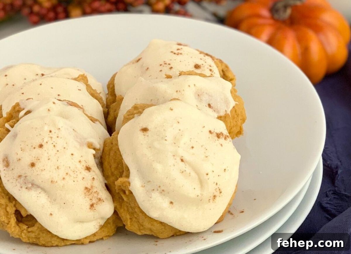 A plate of gluten free pumpkin cookies with dairy free frosting.