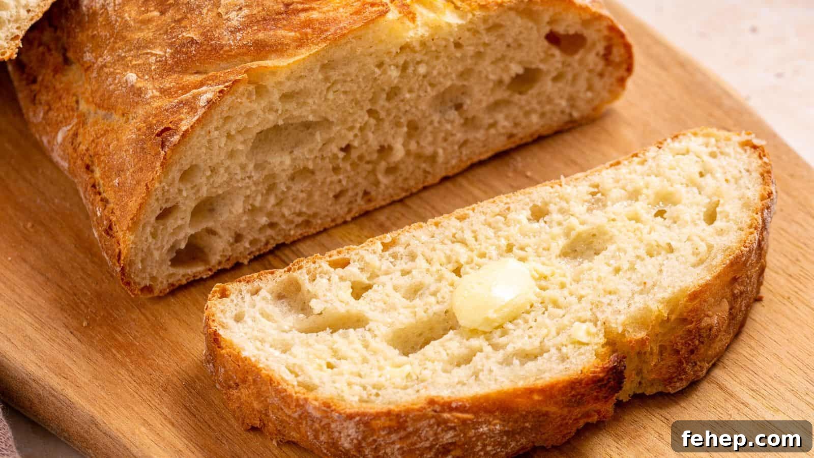 19 Authentic Italian Dinners That Feel Effortless and Homey 13 Italian artisan bread sliced on cutting board.