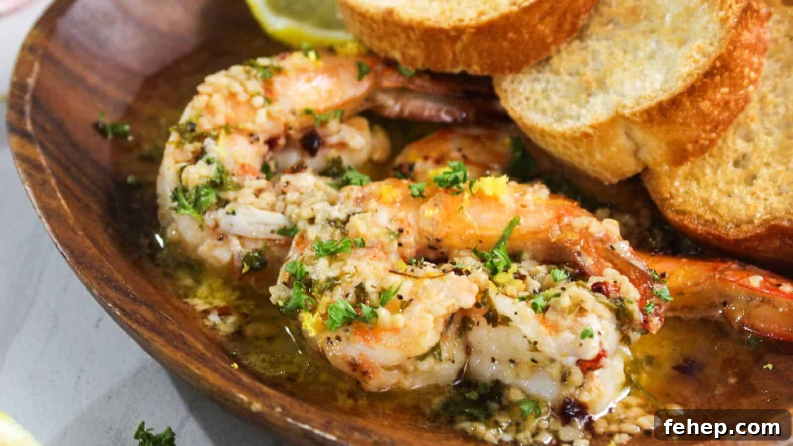 19 Authentic Italian Dinners That Feel Effortless and Homey 17 A plate with shrimp and bread on it.