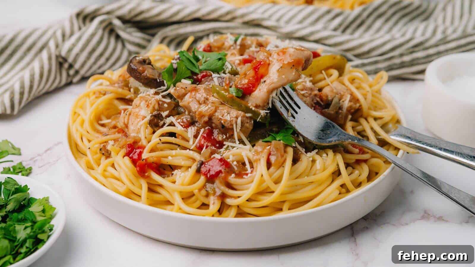 19 Authentic Italian Dinners That Feel Effortless and Homey 18 Plate of spaghetti topped with tomato sauce, mushrooms, and herbs, with a fork and spoon on the side.