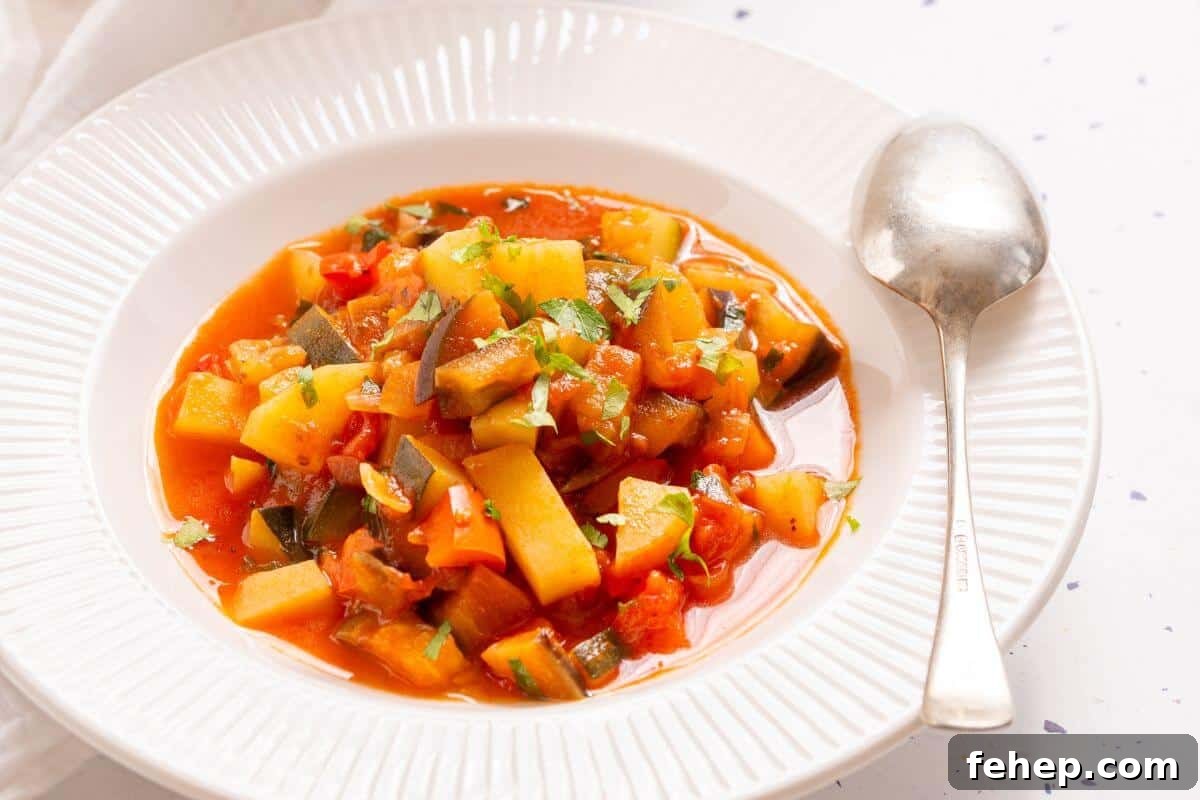 19 Authentic Italian Dinners That Feel Effortless and Homey 7 A pot of Italian vegetable stew with a spoon, garnished with chopped green herbs, on a white tablecloth with a small bowl of parsley on the side.