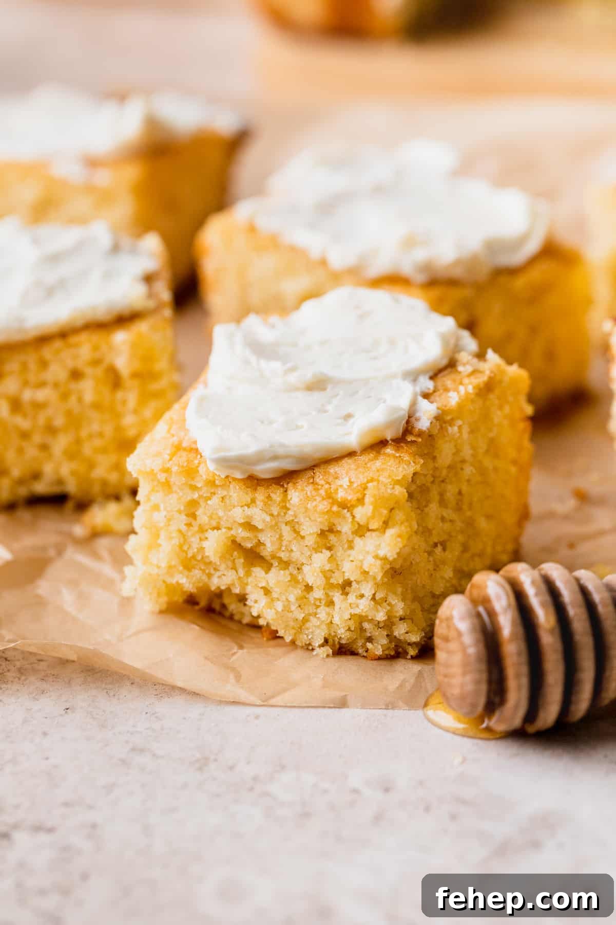 Honey Butter Cornbread Recipe — Sweet Savory Cornbread Guide 2 Honey butter cornbread with butter on top.