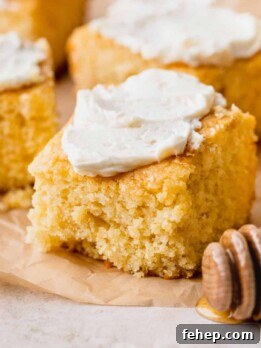 Honey Butter Cornbread Recipe — Sweet Savory Cornbread Guide 12 Honey butter cornbread with butter on top.
