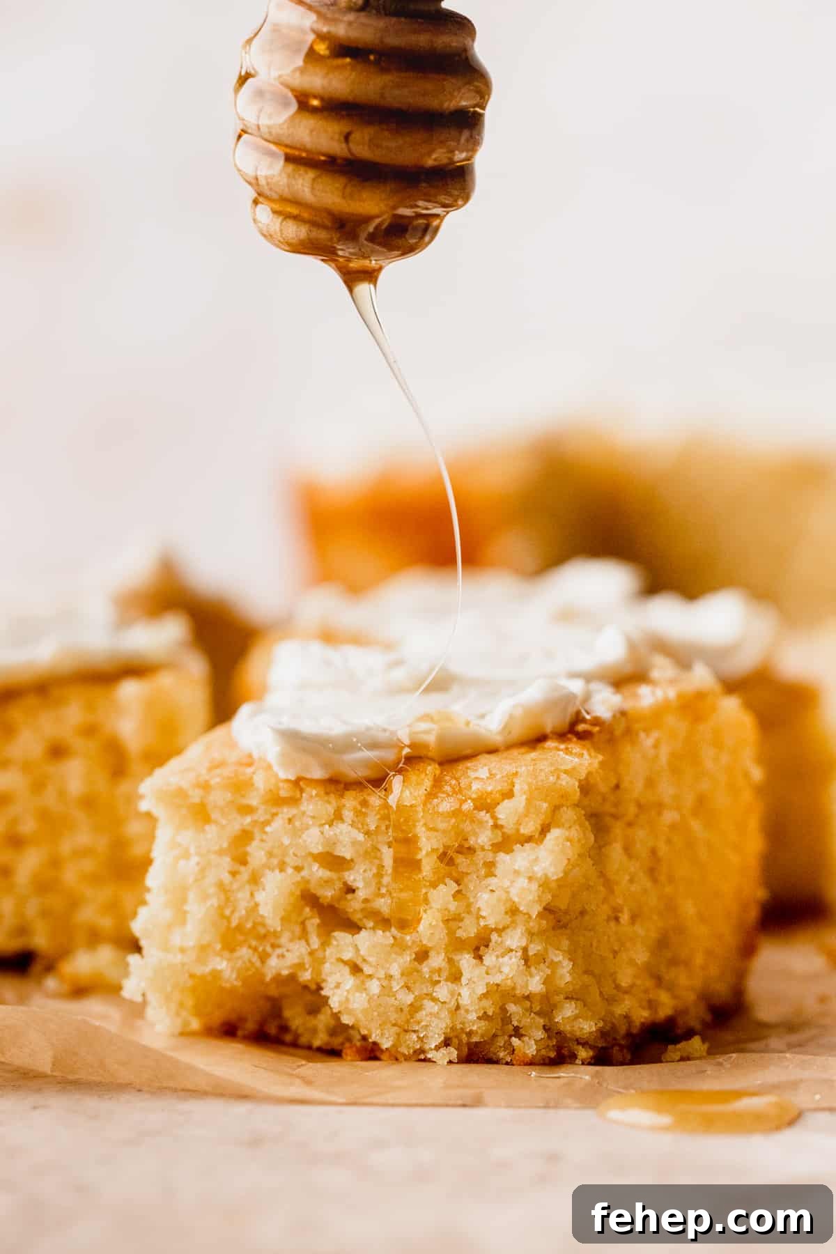 Honey Butter Cornbread Recipe — Sweet Savory Cornbread Guide 3 Drizzling honey on top of cornbread.