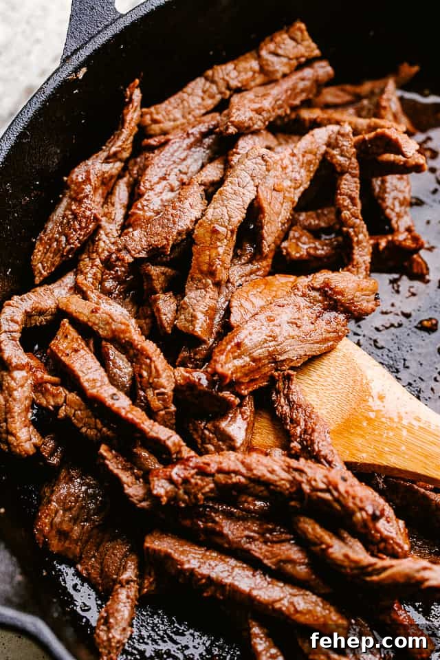 This flank steak with zucchini noodles is the flavorful, summertime dinner you’ve been looking for! Even better, it's ready in 20 minutes! Searing flank steak in a skillet.