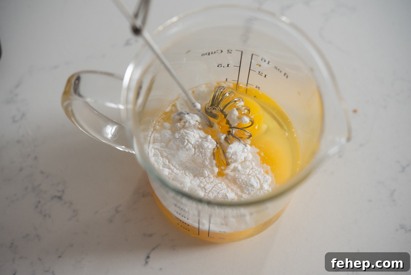 Baking powder added to egg mixture to create a fluffier, higher rise when steamed.