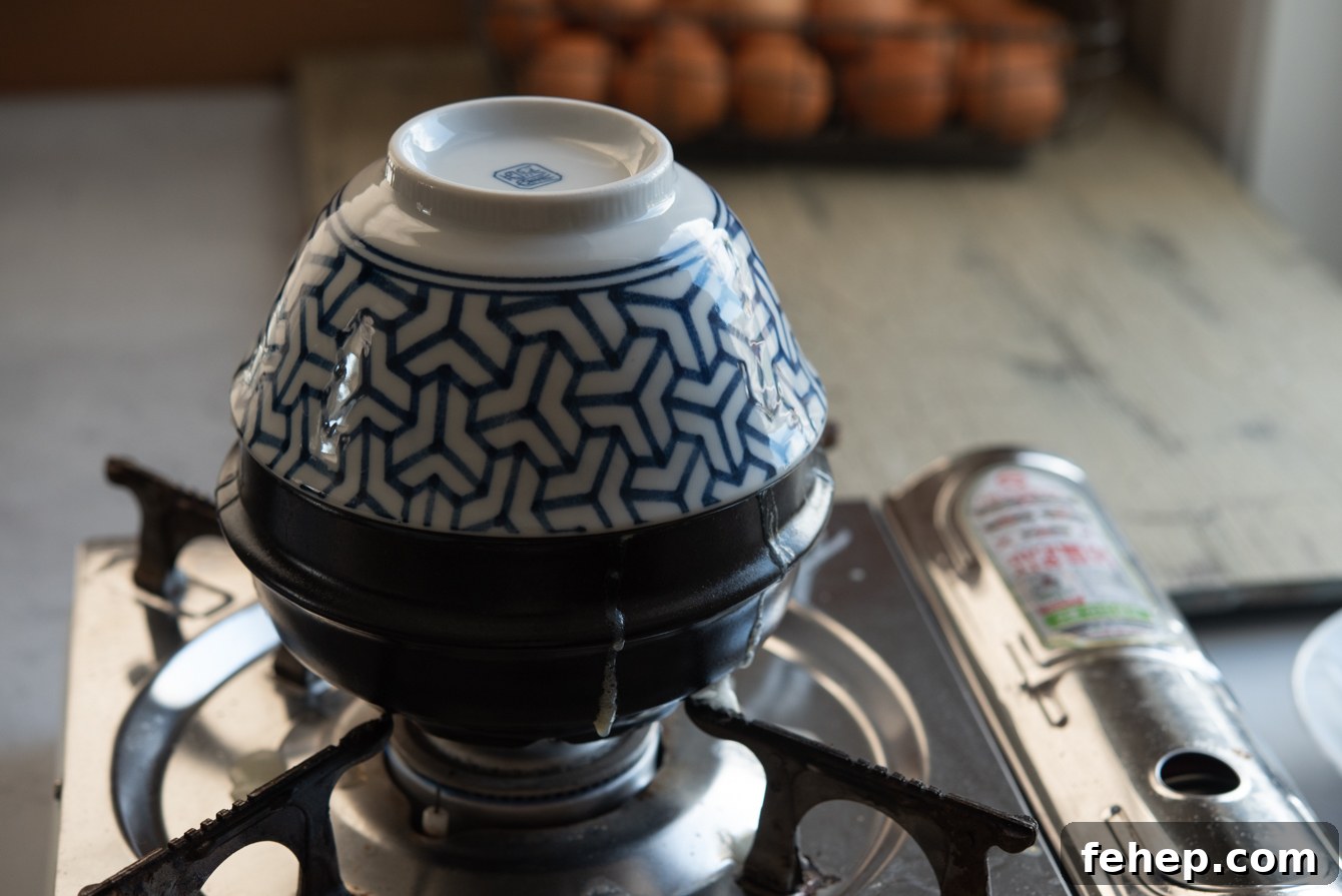 A domed bowl covering a small pot to steam gyeran jjim for a fluffy, soufflé-like finish.