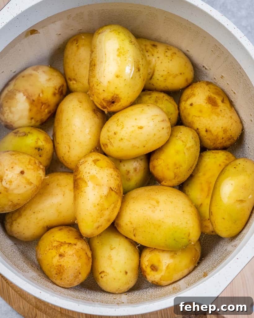 Classic Herbed Potato Salad with Fresh Dill and Chives 5 Boiling potatoes in a large pot.