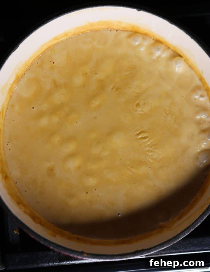 Pot of arroz con leche with milk film
