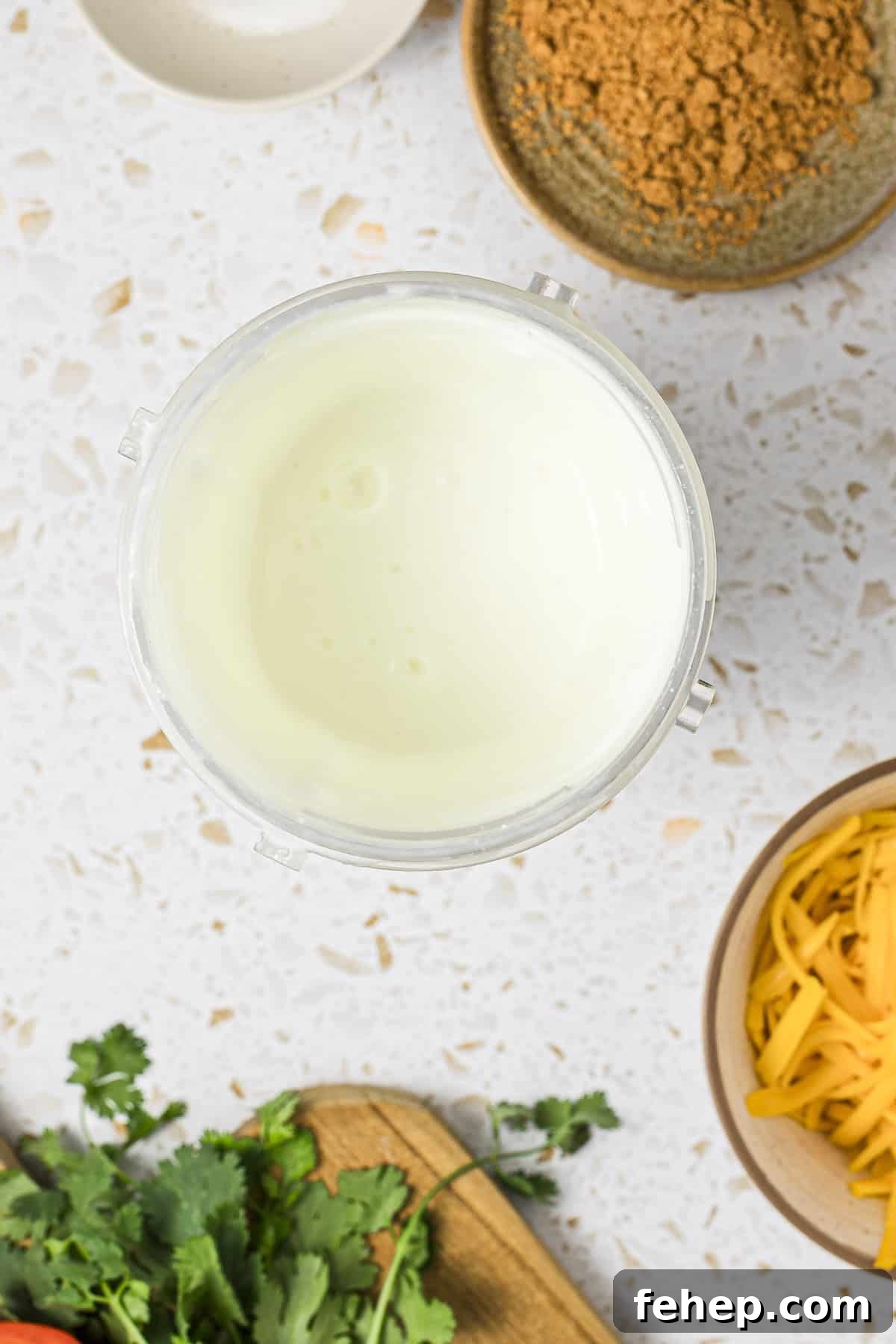 Cottage cheese blended in a small plastic blender cup.