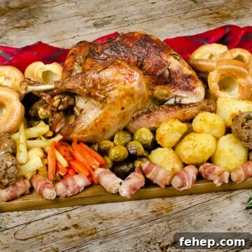 Our cooked Small Whole Turkey served on a chopping board with all the trimmings